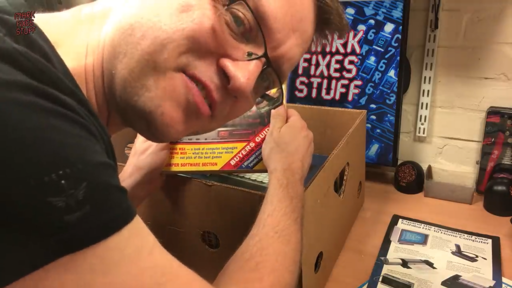 Mark looking through a box of retrocomputer "stuff".