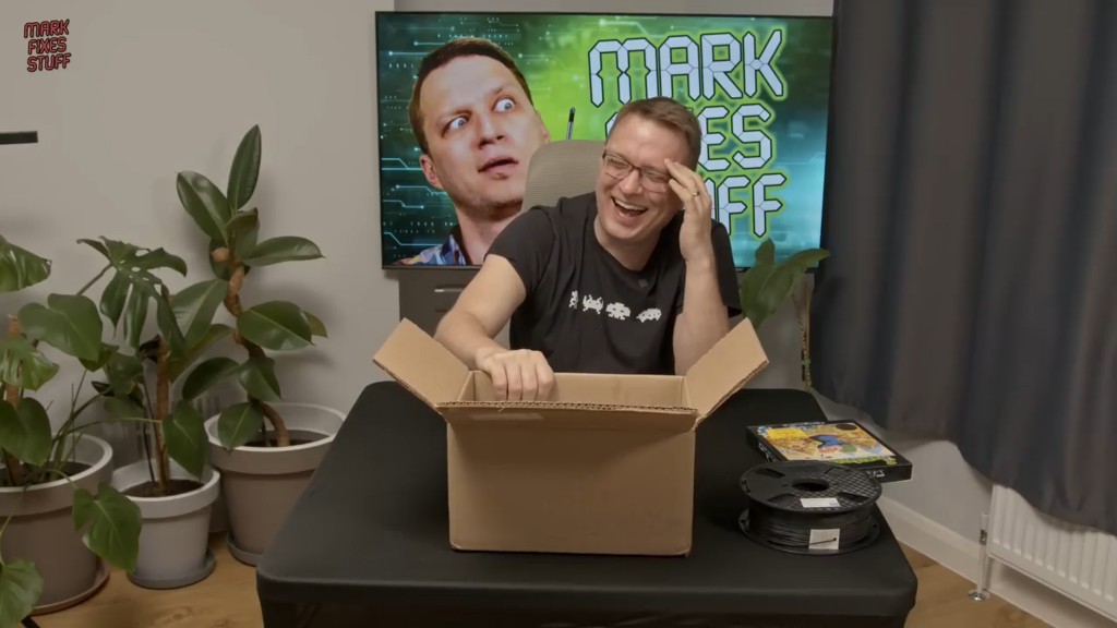 Mark Fixes Stuff opening a a box of Retro Gaming donations.